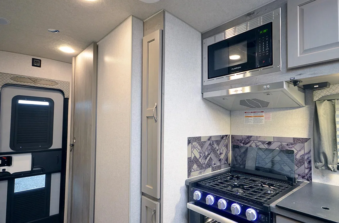 Marcus Reyes diagnosing an RV absorption refrigerator at a Coral Gables service call