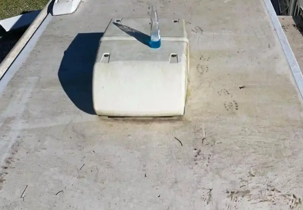 Marcus Reyes applying Dicor lap sealant around an RV vent in Homestead, Miami-Dade
