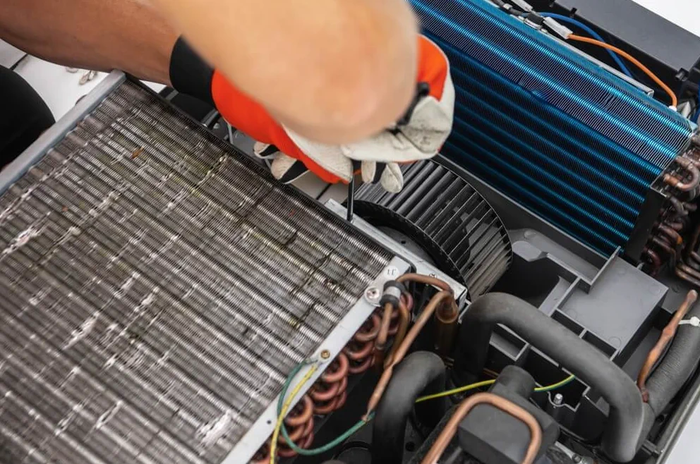 Marcus Reyes inspecting an RV AC fan motor at a Coral Gables RV service call